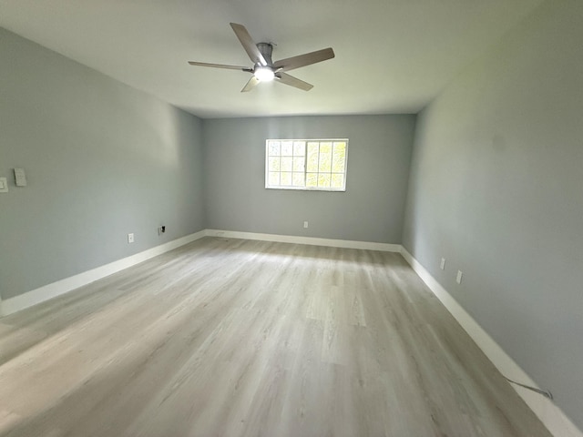 208 Palm Beach Trace Dr, Royal Palm Beach, FL 33411 - spare room featuring ceiling fan, light wood-style flooring, and baseboards