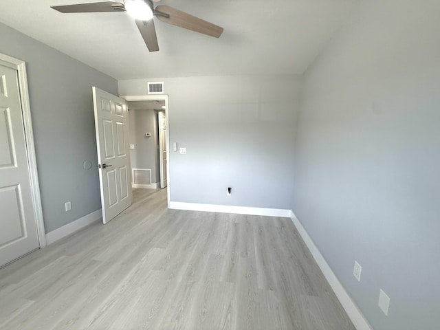 208 Palm Beach Trace Dr, Royal Palm Beach, FL 33411 - unfurnished bedroom with baseboards, light wood-style flooring, and ceiling fan