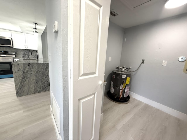 208 Palm Beach Trace Dr, Royal Palm Beach, FL 33411 - utilities with electric water heater and a sink