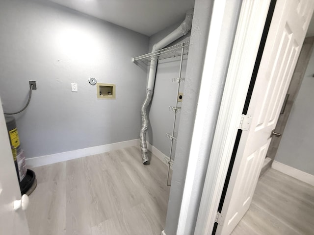 208 Palm Beach Trace Dr, Royal Palm Beach, FL 33411 - laundry room with washer hookup, electric dryer hookup, light wood-style flooring, and baseboards