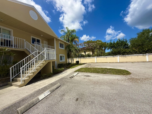 208 Palm Beach Trace Dr, Royal Palm Beach, FL 33411 - exterior space with stairway