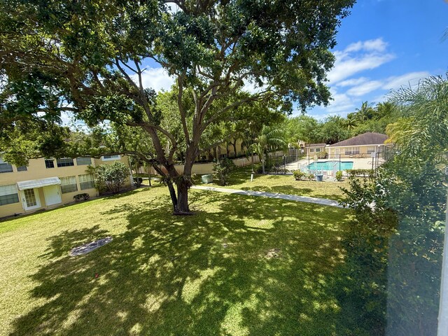 208 Palm Beach Trace Dr, Royal Palm Beach, FL 33411 - view of yard featuring a community pool