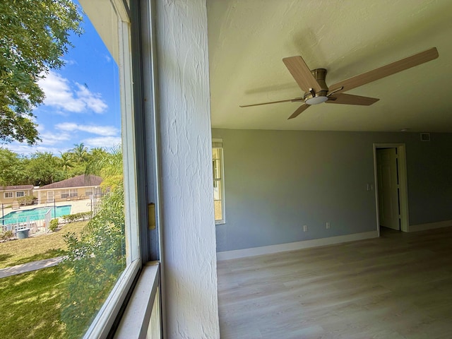 208 Palm Beach Trace Dr, Royal Palm Beach, FL 33411 - unfurnished room with ceiling fan, wood finished floors, and baseboards