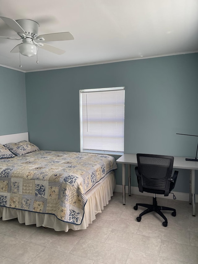 tiled bedroom with baseboards, ceiling fan, and crown molding