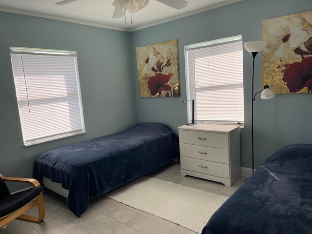 bedroom with light tile patterned floors, crown molding, and ceiling fan