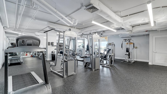 exercise room featuring visible vents and baseboards