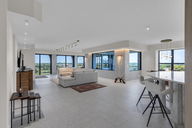 7351 Promenade Dr Unit 801F, Boca Raton, FL 33433 - living room featuring a chandelier and recessed lighting