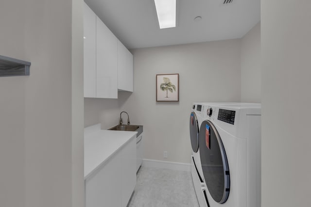 7351 Promenade Dr Unit 801F, Boca Raton, FL 33433 - washroom featuring independent washer and dryer, cabinet space, baseboards, and light tile patterned floors