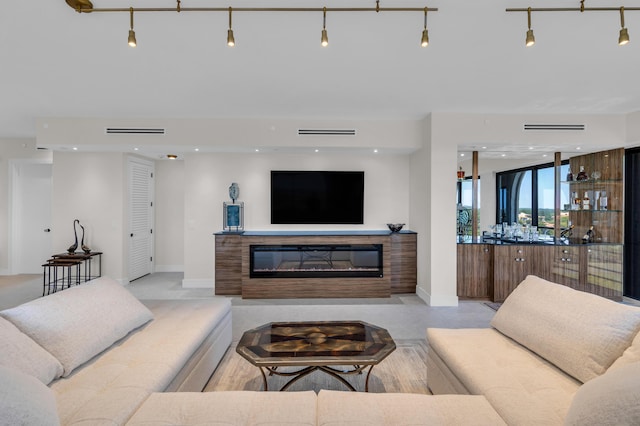 7351 Promenade Dr Unit 801F, Boca Raton, FL 33433 - living area with a glass covered fireplace, baseboards, and recessed lighting