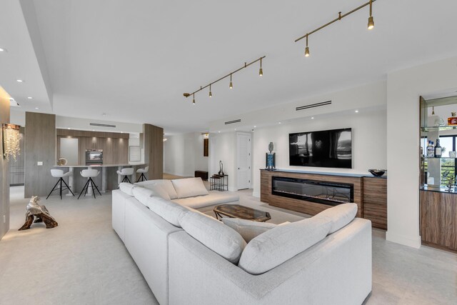 7351 Promenade Dr Unit 801F, Boca Raton, FL 33433 - living room with a glass covered fireplace and recessed lighting