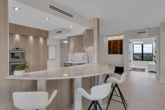 7351 Promenade Dr Unit 801F, Boca Raton, FL 33433 - kitchen featuring modern cabinets, a peninsula, a sink, and recessed lighting