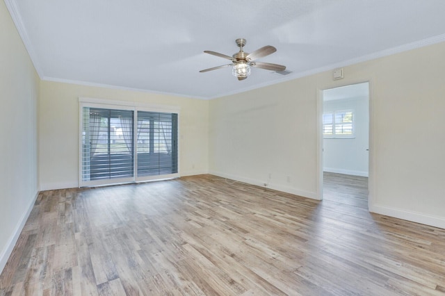 empty room with light wood-style flooring, visible vents, baseboards, a ceiling fan, and crown molding