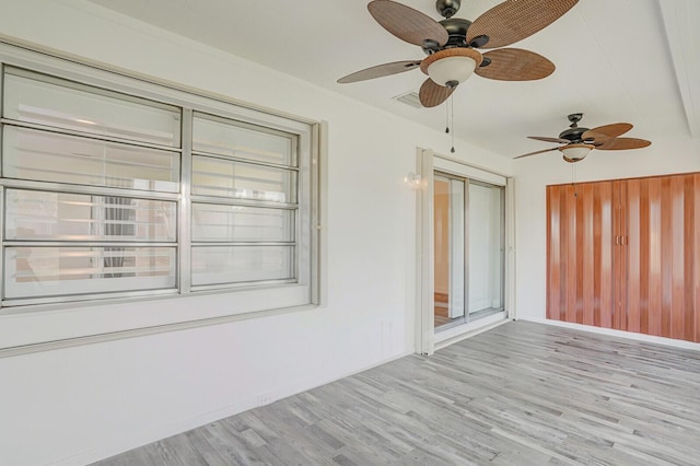 unfurnished sunroom featuring visible vents