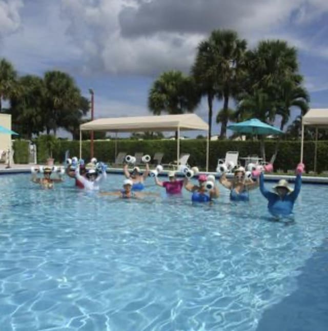 community pool featuring a water play area