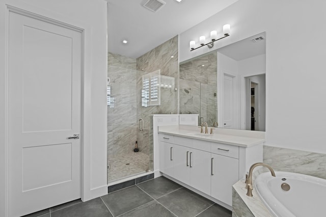 3038 Safflower Cir, West Palm Beach, FL 33401 - bathroom featuring a garden tub, vanity, a stall shower, and tile patterned floors