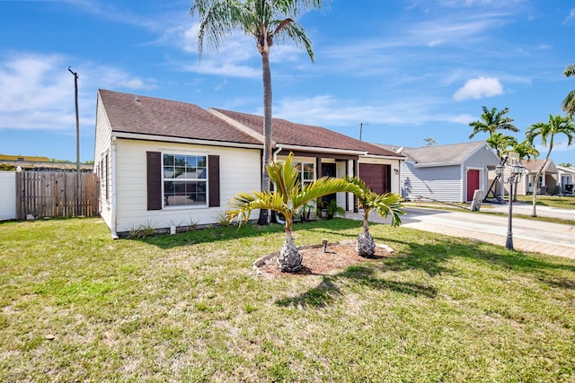 7938 Ridgewood Dr, Lake Worth, FL 33467 - view of front of property with driveway, fence, a garage, and a front lawn