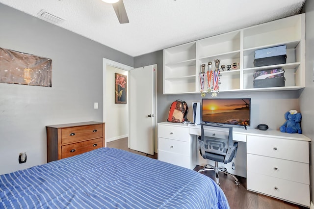 7938 Ridgewood Dr, Lake Worth, FL 33467 - bedroom with visible vents, a textured ceiling, a ceiling fan, and dark wood-style floors