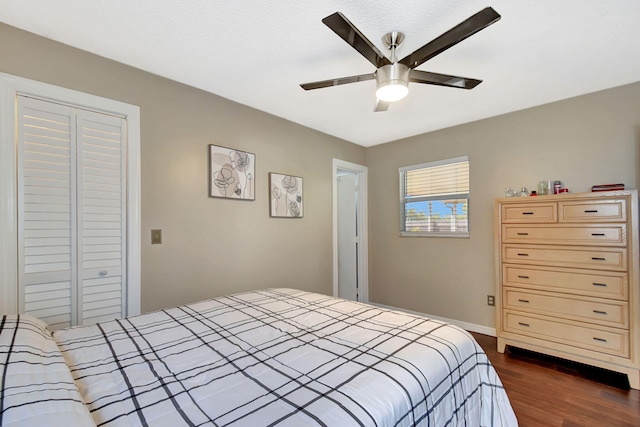7938 Ridgewood Dr, Lake Worth, FL 33467 - bedroom featuring dark wood-style flooring, a closet, ceiling fan, and baseboards