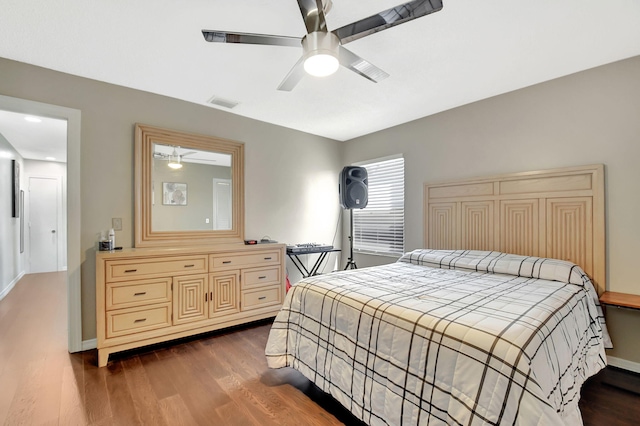 7938 Ridgewood Dr, Lake Worth, FL 33467 - bedroom featuring dark wood-style flooring, visible vents, baseboards, and a ceiling fan