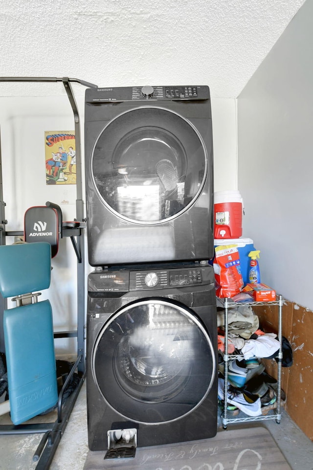 7938 Ridgewood Dr, Lake Worth, FL 33467 - washroom with stacked washing maching and dryer, laundry area, and a textured ceiling