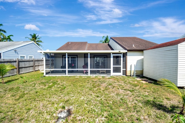 7938 Ridgewood Dr, Lake Worth, FL 33467 - back of house with an outbuilding, a sunroom, a yard, fence, and a shingled roof