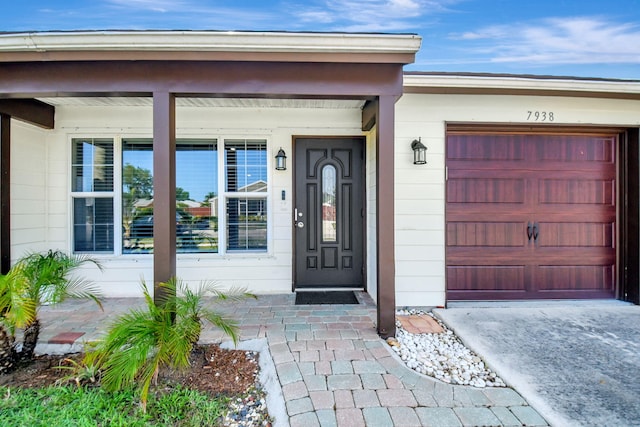 7938 Ridgewood Dr, Lake Worth, FL 33467 - entrance to property featuring a garage and driveway