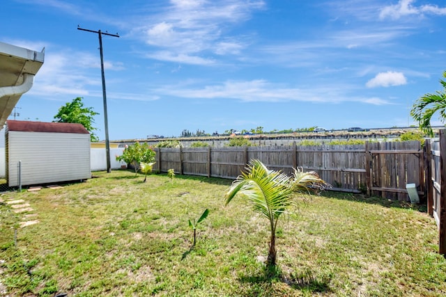7938 Ridgewood Dr, Lake Worth, FL 33467 - view of yard with a fenced backyard, a storage shed, and an outbuilding