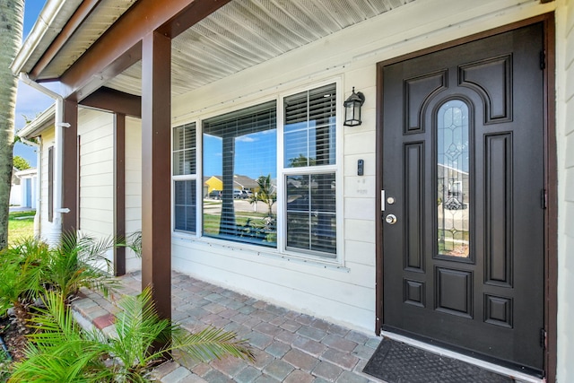 7938 Ridgewood Dr, Lake Worth, FL 33467 - doorway to property featuring covered porch