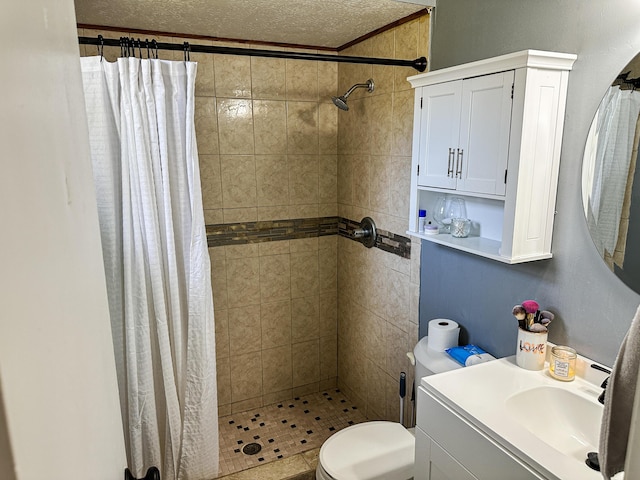 bathroom featuring a shower stall, vanity, crown molding, and toilet
