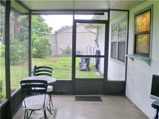 sunroom with plenty of natural light and visible vents