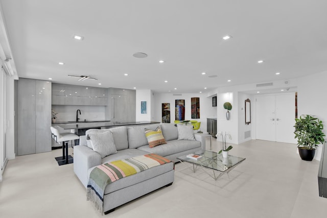 living area featuring recessed lighting and visible vents