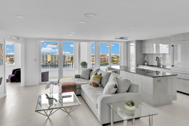living area with a water view and visible vents