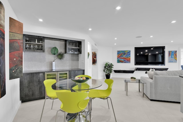 dining space with recessed lighting and wine cooler