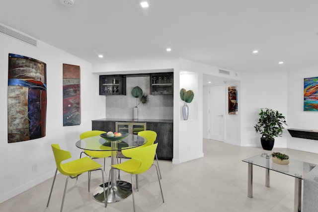 dining room with baseboards, recessed lighting, and visible vents
