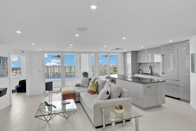 living area featuring recessed lighting, ceiling fan, and visible vents