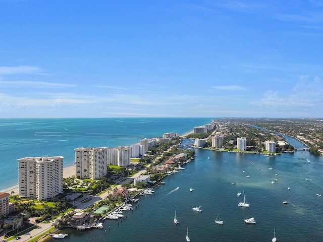 birds eye view of property featuring a view of city and a water view