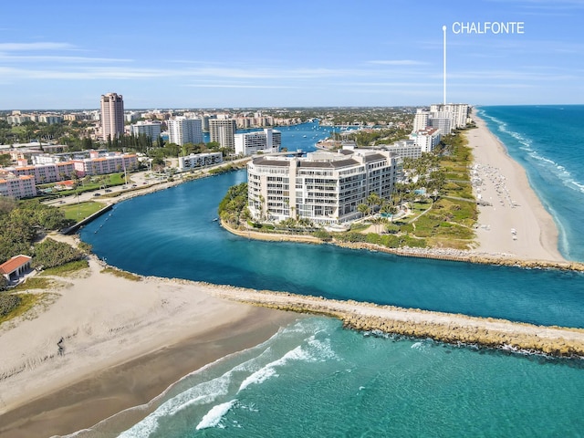 bird's eye view featuring a view of city, a beach view, and a water view