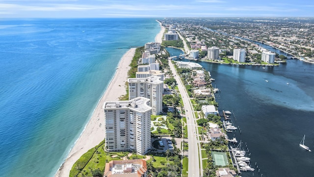 aerial view featuring a view of city, a beach view, and a water view