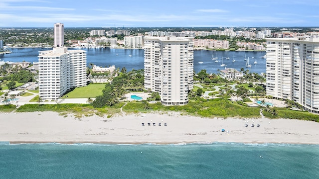 aerial view featuring a beach view, a water view, and a city view