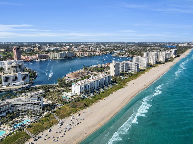 bird's eye view with a city view, a beach view, and a water view