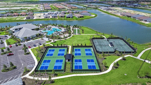 drone / aerial view with a residential view and a water view
