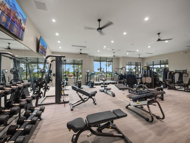 gym featuring light carpet, recessed lighting, and ceiling fan