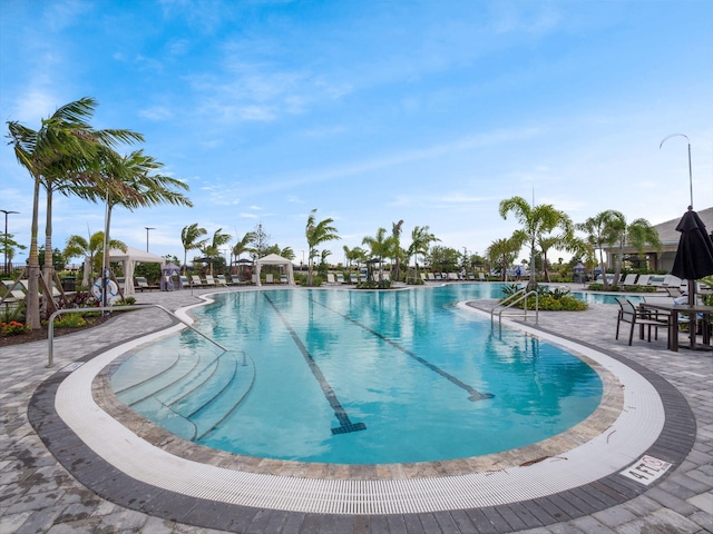 pool featuring a patio area and a gazebo