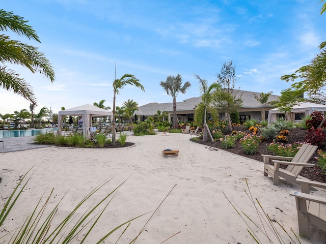 surrounding community featuring a gazebo and a swimming pool