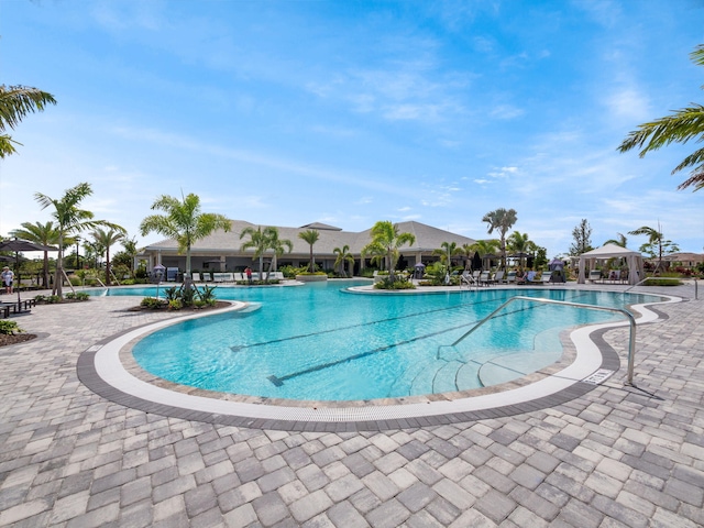 pool with a gazebo and a patio