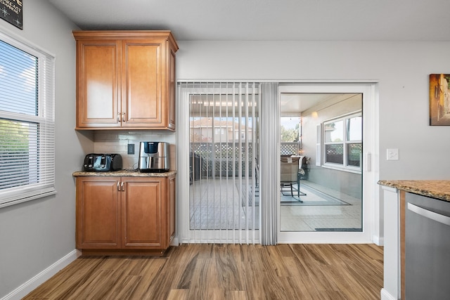 3531 SW Sunset Trace Cir, Palm City, FL 34990 - doorway to outside with baseboards and wood finished floors