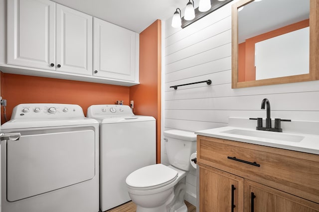 3531 SW Sunset Trace Cir, Palm City, FL 34990 - bathroom featuring toilet, washer and dryer, and vanity