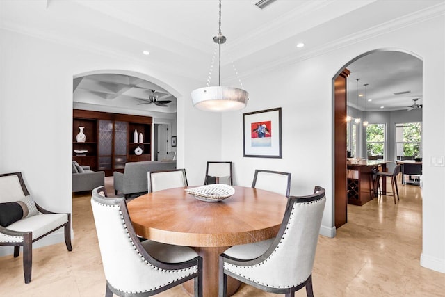 dining space featuring crown molding, recessed lighting, arched walkways, and ceiling fan