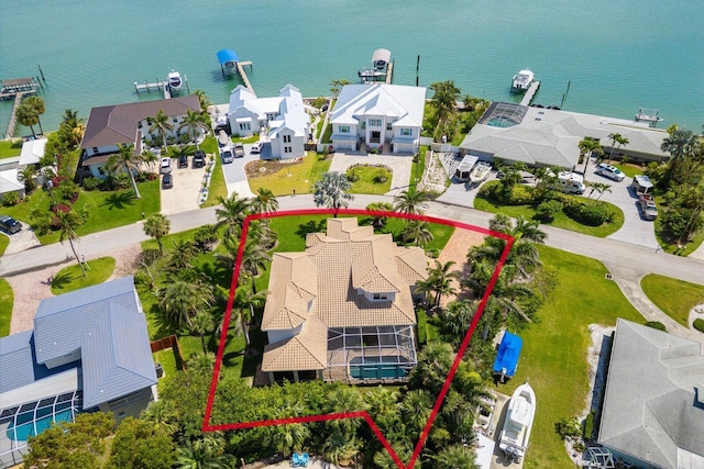 bird's eye view with a residential view and a water view