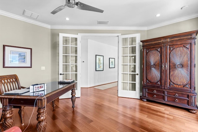 home office with visible vents, ceiling fan, light wood-style floors, and french doors